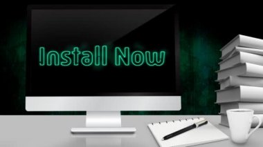 Kelimelerin animasyonu Bir yığın kitapla birlikte beyaz bir masada duran bilgisayarın ekranında titreşen Şimdi Yükle. İletişim ve bağlantı konsepti dijital olarak oluşturuldu.