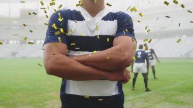 Kafkas erkek rugby oyuncusunun üzerine düşen altın konfeti animasyonu kameranın dijital kompozisyonuna bakıyor