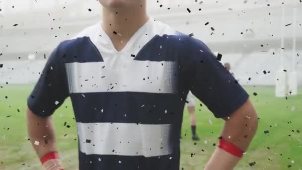 Animación Confeti Negro Cayendo Sobre Jugador Rugby Masculino Caucásico Mirando — Vídeo de stock