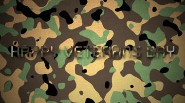 Ordu kamuflajının üzerine beyaz harflerle 