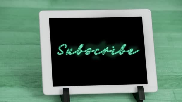 Animation Green Neon Style Word Subscribe Flickering Screen Digital Tablet — Stock Video