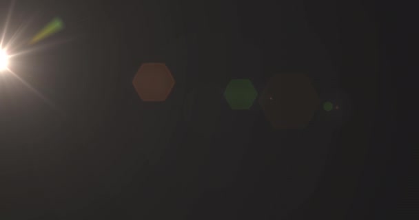 褐色背景下无缝环催眠运动中发光黄斑的动画化 — 图库视频影像