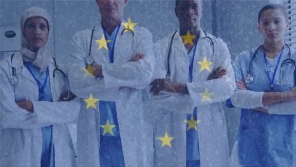 Animation Yellow Stars Spinning Multi Ethnic Group Doctors Crossing Arms — Stock Video