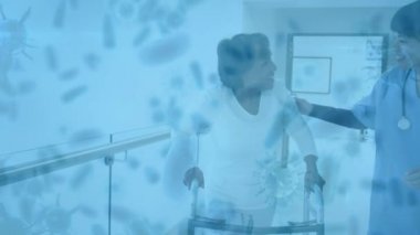 Asyalı bir kadın sağlık görevlisi ve hastasının hastane koridorunda konuştuğu yerde süzülen makro covid-19 hücrelerinin animasyonu. Coronavirus Covid-19 pandemik konsept dijital bileşik