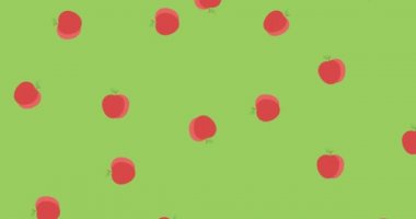 Yeşil zemin üzerinde düzgün bir şekilde dönen ve düşen çoklu kırmızı elmaların animasyonu. Hareket ve tekrarlama konsepti dijital olarak oluşturuldu.