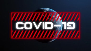Kırmızı çerçeveli Covid-19 metnin animasyonu. Arkasında Dünya gezegeni var. Küresel koronavirüs salgını konsepti dijital olarak oluşturuldu. NASA tarafından sağlanan video ögeleri.
