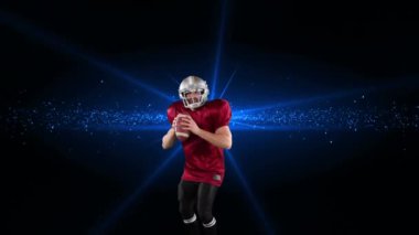 Erkek rugby oyuncusunun siyah arkaplana karşı mavi ışıklı noktaya top attığı dijital video.