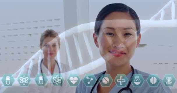 Animation Dna Strands Spinning Medical Icons Portrait Two Female Doctors — Stock Video