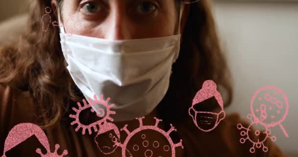 Animacja Różowego Covid Ikon Koronawirusa Nad Portretem Kobiety Noszącej Maskę — Wideo stockowe