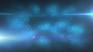 Hipnotize edici hareketlerle süzülen parlak mavi ışık lekelerinin animasyonu. Karanlık bir arka planda pırıl pırıl bir lens ışığı. Işık, renk ve hareket kavramı dijital olarak oluşturuldu.