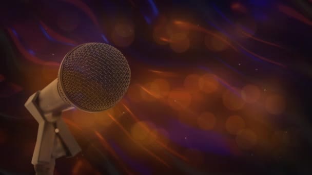 Animacja Mikrofonu Pomarańczowymi Plamkami Światła Świecącymi Poruszającymi Się Hipnotycznym Ruchu — Wideo stockowe