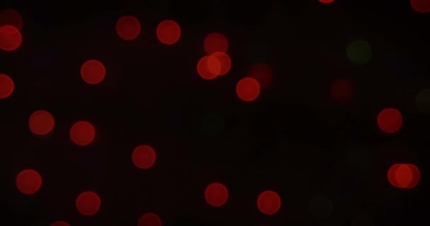 闪烁不定的Bokeh光的发光红斑的动画 催眠地在黑暗的背景上与镜头耀斑一起漂浮 色和运动概念数字生成的图像 — 图库视频影像