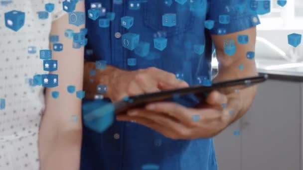 Animación Múltiples Iconos Azules Sobre Hombre Mujer Usando Tableta Digital — Vídeo de stock