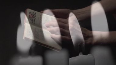 Dua eden, İncil 'i tutan ve mumların söndürüldüğü animasyon. Din inancı geleneği doğa konsepti dijital olarak oluşturulmuş görüntü.