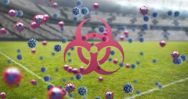 3D koronavirüs hücrelerinin ve boş stadyumun üzerinde yüzen biyolojik tehlike sembolünün animasyonu. Global Covid 19 koronavirüs pandemik spor konsepti dijital olarak üretilen görüntü.