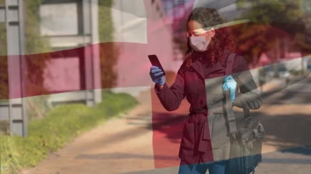 Animation English Flag Waving Woman Wear Face Mask Using Smartphone — Αρχείο Βίντεο