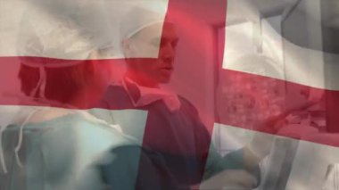 Çeşitli doktorların hastanede iş görüşmesi üzerine İngiltere bayrağının animasyonu. Dijital olarak üretilen tıp, hastane, sağlık ve vatanseverlik konsepti.