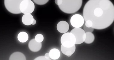 Siyah arka planda hareket eden beyaz noktaların animasyonu. Şekiller ve şablon konsepti dijital olarak oluşturulmuş video.