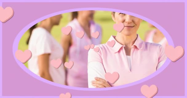 Animation Hearts Believe Text Caucasian Women Wearing Pink Shirts Global — Stock Video