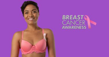 Image of breast cancer awareness text over smiling african american woman on purple background. breast cancer positive awareness campaign concept digitally generated image. clipart