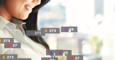 Woman lifting phone and scrolling social media feed creating notification icons tracking engagement. Technology, connectivity, communication, digital, professional, urban, modern