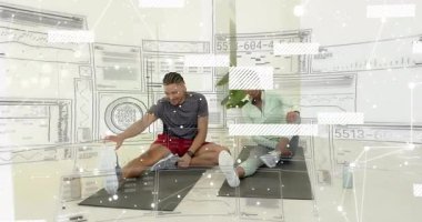 Friends grabbing water bottle, sipping, extending legs, deepening stretch on yoga mats in home gym. Fitness, yoga, stretching, wellness, casual, home, health