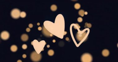 Üç soluk şeftali kalp başladıktan sonra yukarı doğru yüzüyor altın ışıklar arasında dönüp duruyor. Romantik, ruhani, soyut, aydınlık, uyum, hareket, minimalist