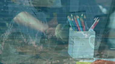 Animation of financial data and graphs over box with pencils and caucasian man with laptop. Business, finance, web development, finance and technology concept digitally generated video.