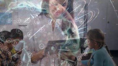 Teacher tapping tablet screen and bringing up rotating globe overlay for digital education. Interactive, innovation, edtech, futuristic, collaboration, digital, education