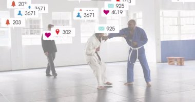 Two fighters in gis sparring, clinching and throwing in sports tech, generating social metrics. Martial arts, combat sports, high-intensity training, athleticism, fitness, digital interaction, social media