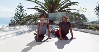 Man and woman arriving on terrace unrolling mats holding pose with fitness stats fluctuating. Outdoor, wellness, harmony, serenity, motivation, landscape, strength