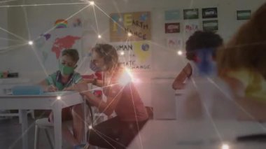 Diz çökmüş sınıf öğretmeninin Dünya posterlerine karşı önderlik ettiğini gösteren karartma. Eğitim, akıl hocalığı, işbirliği, öğrenme, sınıf, gençlik, rehberlik