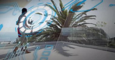 Kadın çatıya giriyor ve holografik UI gösteriyor. Bu sırada erkek de spor olsun diye yoga minderini açıyor. Açık hava, fitness, teknoloji, sağlık, işbirliği, modern, ilham verici.