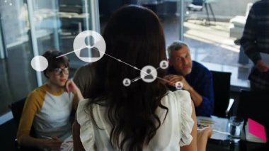 Animation of network of connections with people icons over diverse business people. Global connections, networks and business concept digitally generated video.
