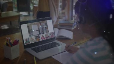 Girl connecting laptop to online class, taking notes as animated nodes linking education concepts. Digital learning, remote education, e-learning, virtual classroom, student focused, creative workspace, modern technology