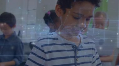 foreground boy tapping tablet screen and causing floating data graphics for education engagement. Technology, digital learning, education, innovation, classroom, youth, interactive