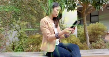 Businesswoman tapping tablet screen and generating green circuit overlays for data visualization. Technology, data, innovation, digital, communication, outdoor, professional