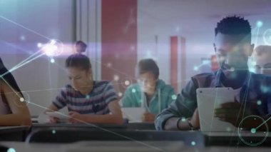 Adult male retrieving tablet and tapping screen, network linking desks for education collaboration. Collaboration, digitaleducation, modernclassroom, interactivelearning, connectivity, teamwork, technology