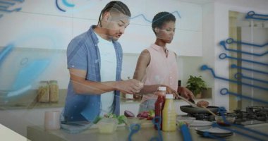 Ev aşçıları tavayı ocağa yerleştirip yumurtayı kırarken animasyon ikonlar da yemek tarifini takip ediyor. Aşçılık, aşçılık, takım çalışması, yerli, modern, canlı, hazırlık