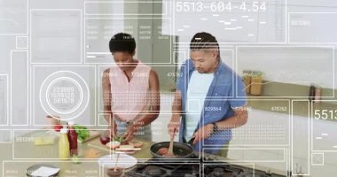 Çiftler hamburgerleri hazırlamaya çörekleri dilimleyip tavaya köfte koyarak ve malzemeyi birleştirerek başlıyorlar. Yemek pişirme, takım çalışması, aşçılık, modern, yerli, hazırlık, gastronomi