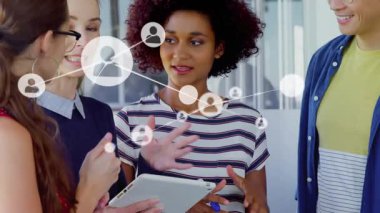 Animation of network of connections with people icons over diverse business people. Global connections, networks and business concept digitally generated video.