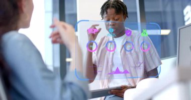 Woman raising hands and man tapping tablet initiating holographic data panels for business meeting. Technology, innovation, collaboration, futuristic, analytics, digital, corporate