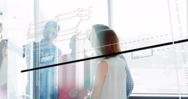 AR overlay fading, presenter stepping forward tracing business trend line on glass wall for review. Collaboration, analytics, innovation, teamwork, corporate, data visualization, modern