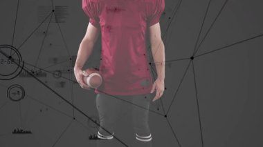 Athlete shifting stance and rotating ball activating data charts animating for sports analytics. Sports, technology, futuristic, performance, motion, innovation, dynamic