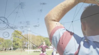 Lineout atıcısı top atışını başlatıyor, rugby topu ele geçirme için kaldırma zamanlamasını gösteriyor. Atletizm, takım çalışması, rekabet, sportmenlik, eğitim, açık hava, hareket