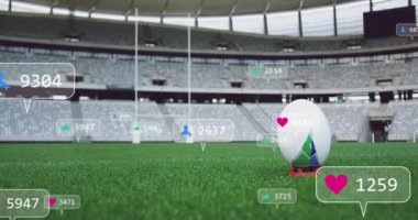 Kırmızı tişörte tünemiş ragbi topunun etrafındaki örtüler stadyumdaki artan nişan sayısını gösteriyor. Spor, stadyum, dijital, etkileşim, olay, enerji, eğlence