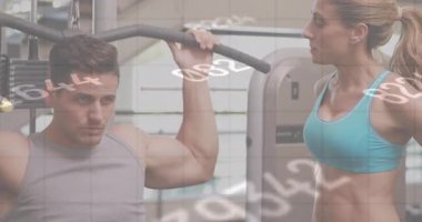 Spor salonunda çalışan beyaz formda bir adama karşı birden fazla değişen numara. Küresel iş verileri ve fitness teknolojisi kavramı