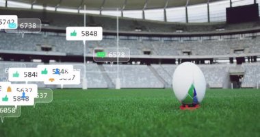 Kırmızı tişörtün üzerinde dinlenen rugby topu artan nişan istatistiklerini gösteren dijital simgeler oluşturmaya başladı. Spor, stadyum, dijital, katılım, rekabet, açık hava, teknoloji