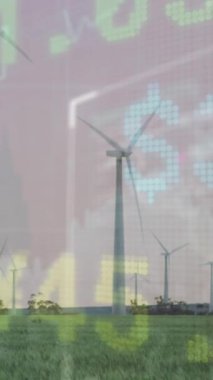 Otlaklarda dönen yel değirmenlerine karşı borsa veri işleme animasyonu. Küresel ekonomi ve yenilenebilir enerji teknolojisi kavramı