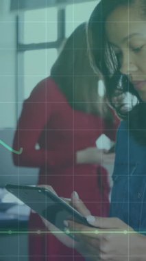 Animation of financial data processing over caucasian businesswoman using tablet in office. Global networks, computing, business, finance and data processing concept digitally generated video.